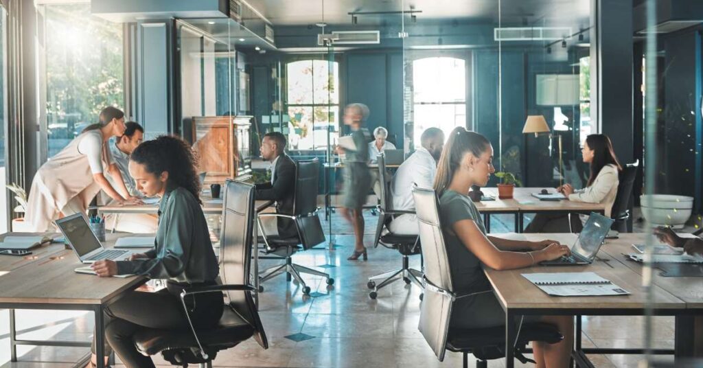 Men and Woman working in full office Stock Image