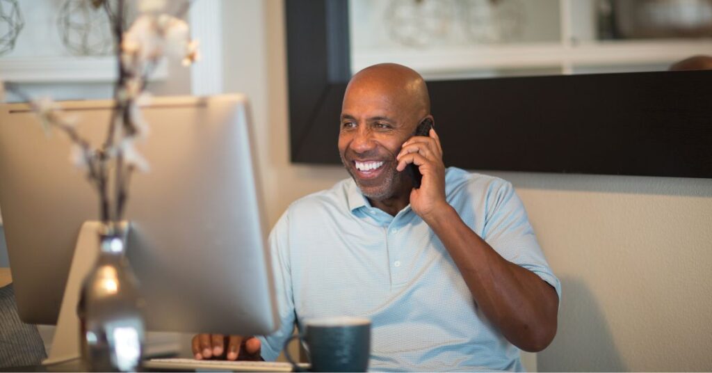 Man on phone in home office