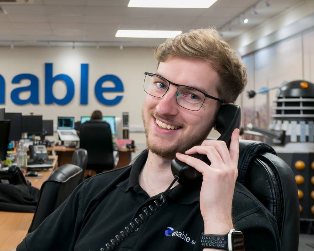 man smiling to camera on the phone