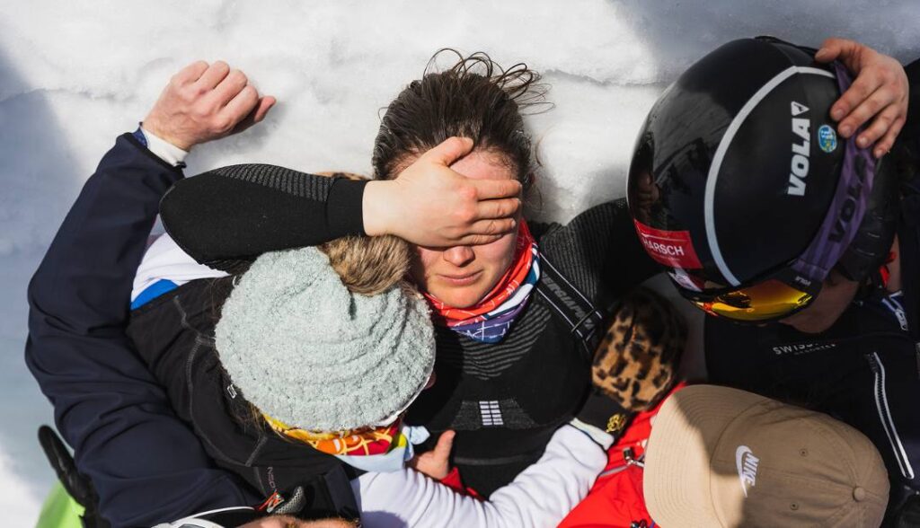 Jasmin Taylor Telemark Skier laying on snow