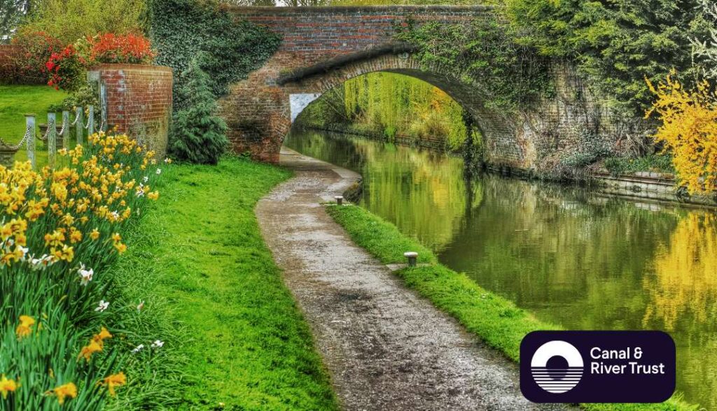 Image of canal with Canal & River Trust logo in bottom right-hand corner