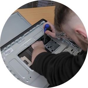 Man fixing a PC with tool